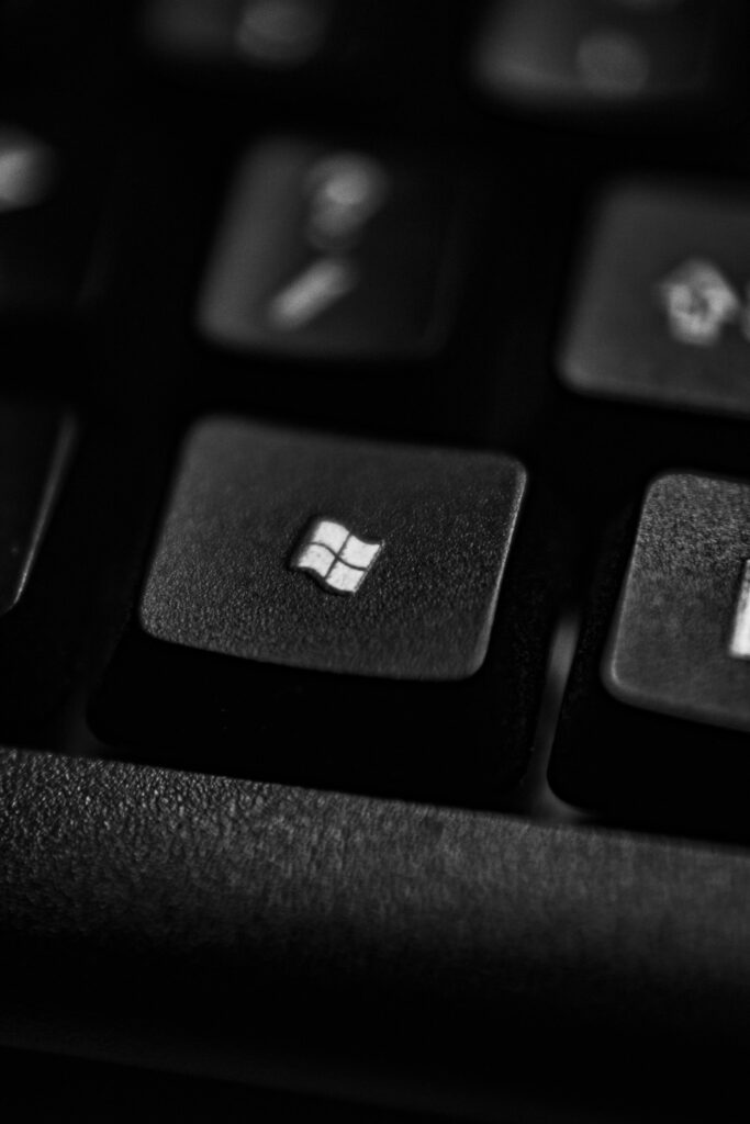 pexels photo 4567339 4567339 High-quality close-up of a Windows logo key on a black plastic keyboard.